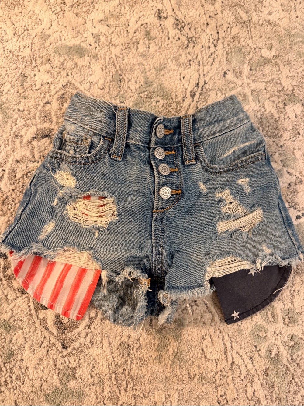 Old Navy Girls Blue Distressed Denim Shorts with Flag Patch Accents
